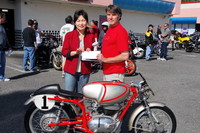 June Lee Owner of Beach Burgers & Robert Bryson with the 1970 Moto Parilla